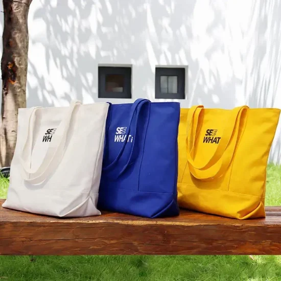 La bolsa de asas de compras de comestibles de lona de algodón orgánico grande a granel lisa reutilizable respetuosa con el medio ambiente impresa con logotipo personalizado